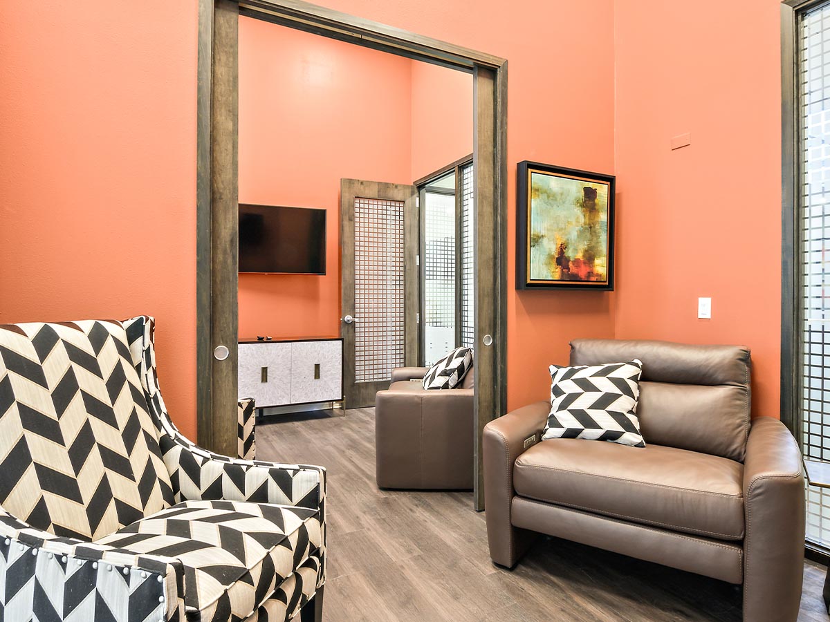 A patient relaxing in a comfortable infusion chair